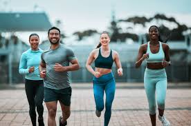 Sculpting Sleek Arms: The Essential Role of Cardio in Toning Without Bulking Up 3 image of people running to incorporate cardio Beaconsfield exercise into their life to help tone arms and body.